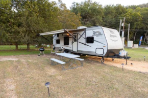 RV located on private property, providing access to the Guadalupe River, accommodates up to 4 guests